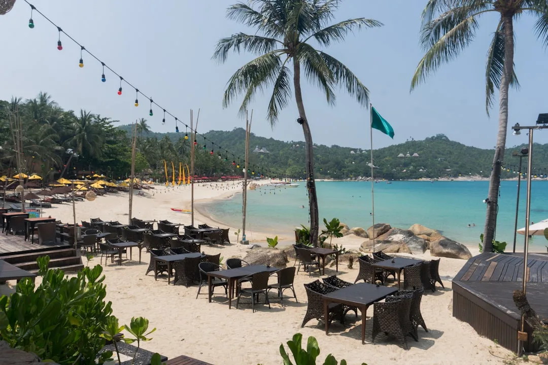 Catch Beach Club Surin Beach Phuket — infinity pool with Andaman Sea views and sunset setting