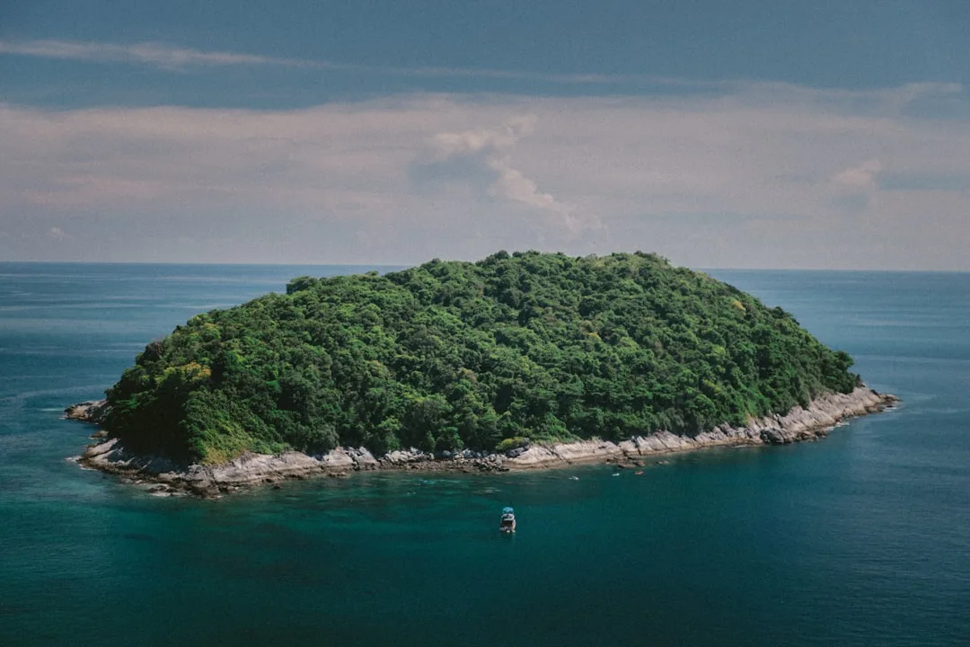 Coral Island Phuket turquoise bay and Long Beach seen from a speedboat near Chalong Pier