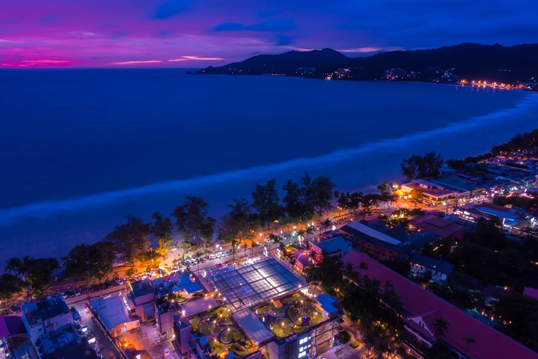 Water sports at Patong Beach Phuket — jet skis, parasailing and banana boats on the Andaman Sea