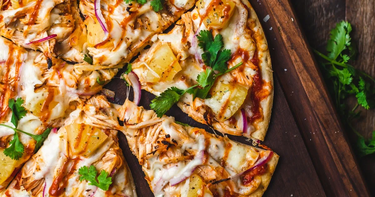Aerial view of a Phuket night market with rows of food stalls and colourful canopies at dusk
