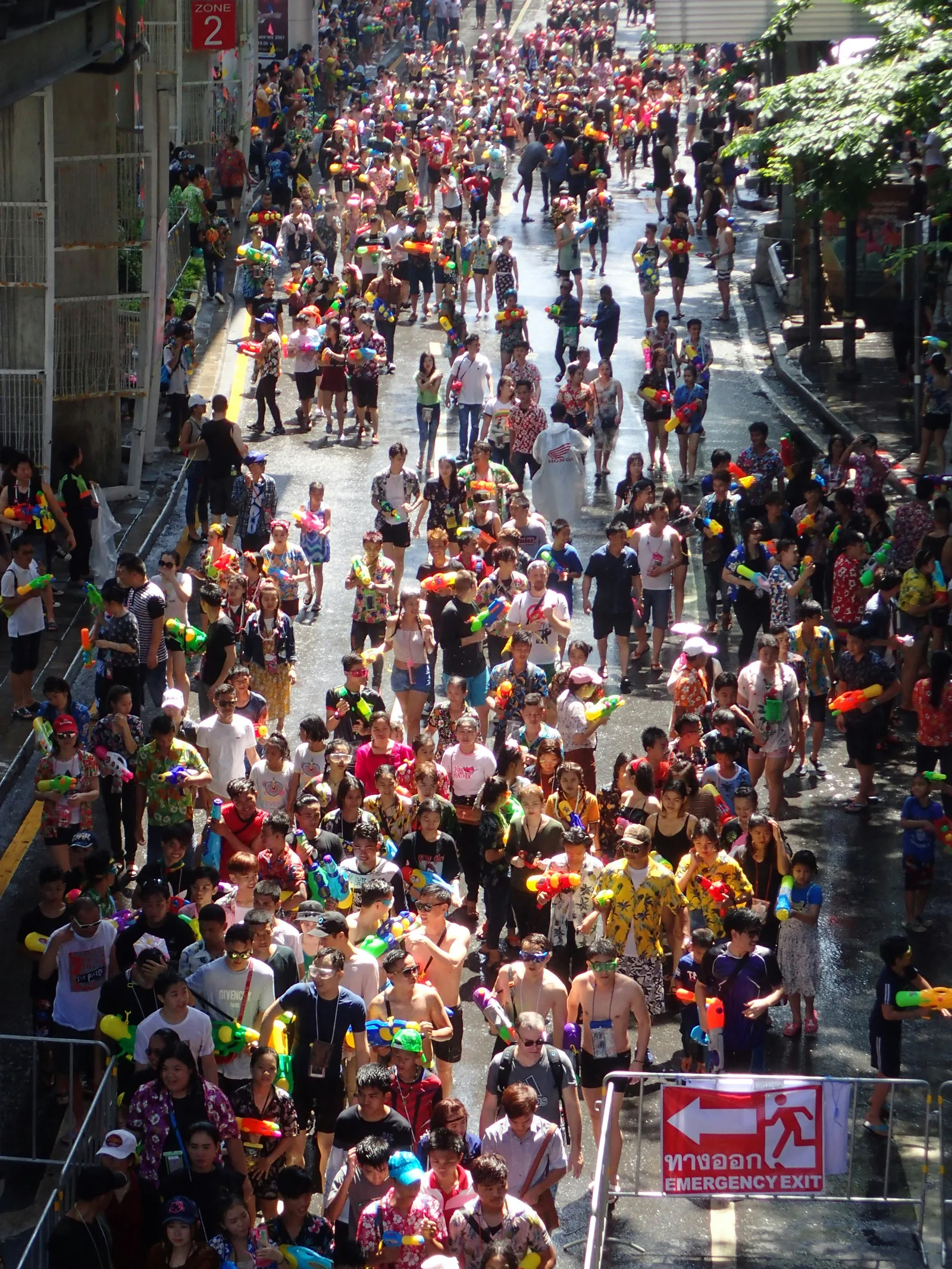 Aerial view of a packed Bangla Road in Patong during Songkran, with revellers armed with water guns