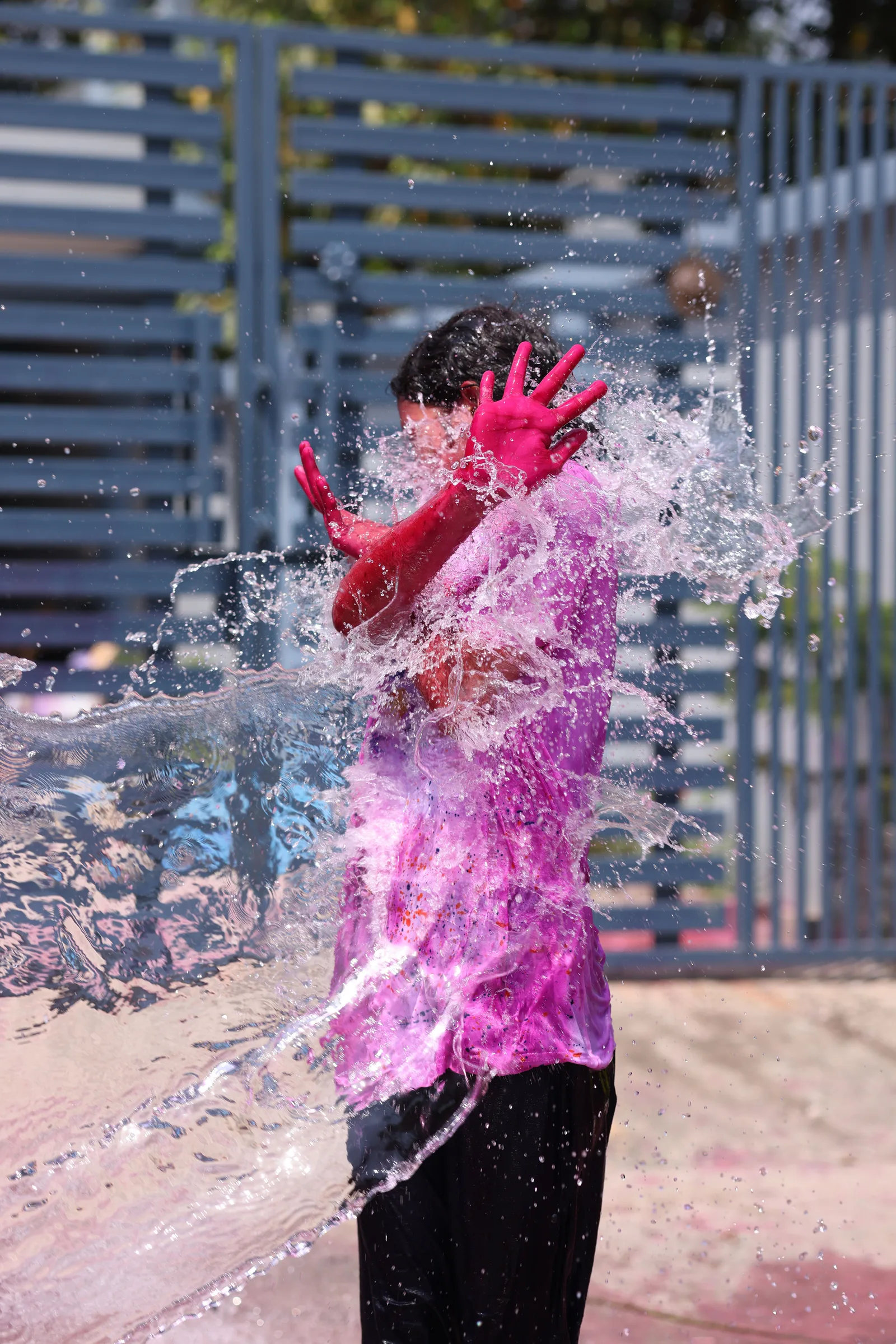 A festival-goer drenched in a burst of water during Songkran celebrations in Phuket