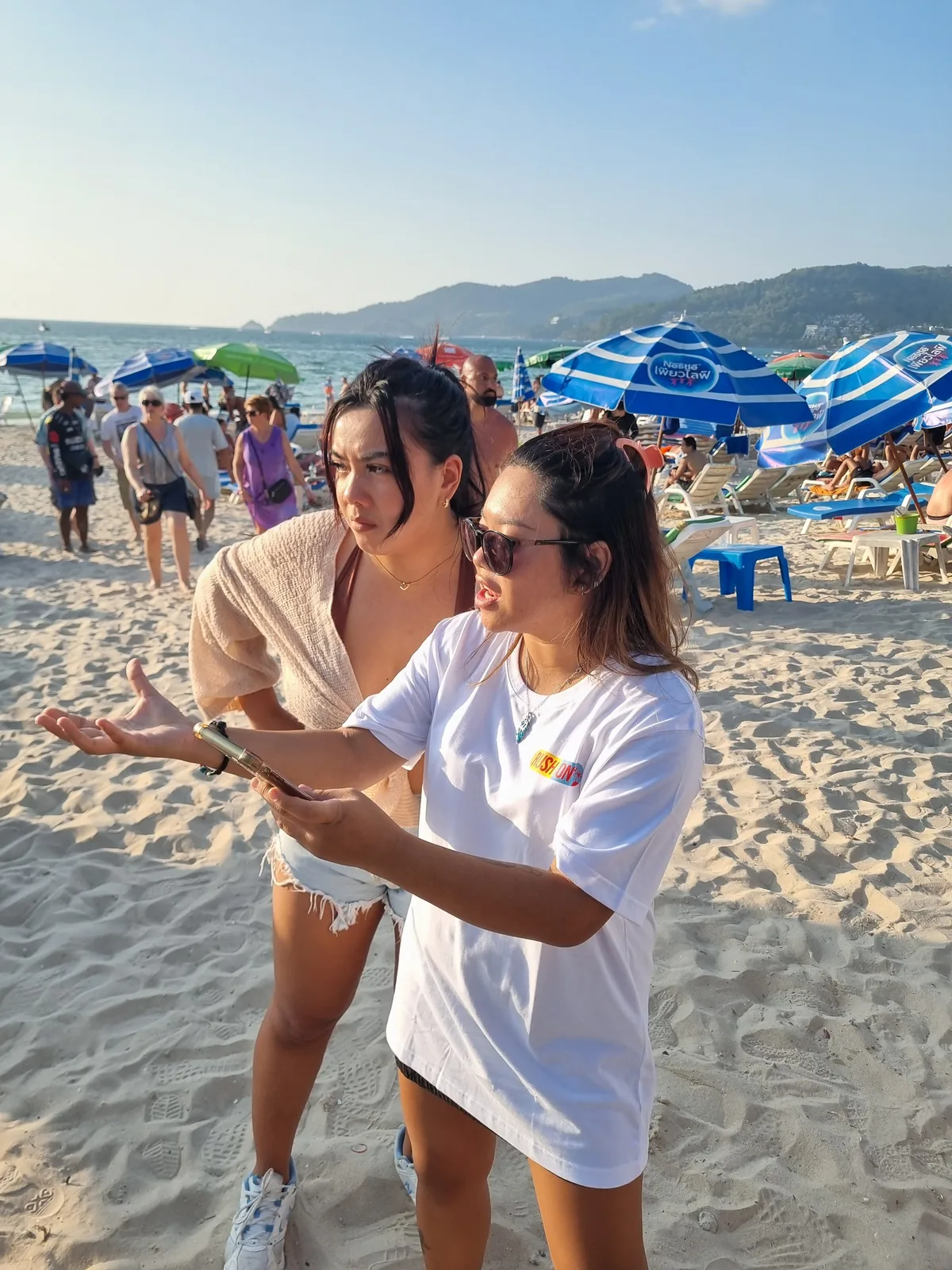 Scavenger hunt team solving clues at a Phuket landmark